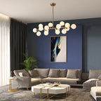 Lustre linéaire moderne du milieu du siècle de 101,6 cm (40 po), suspension Sputnik en laiton doré à 16 lumières avec globe en verre dépoli pour salle à manger