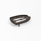 Dessous de plat en fer vintage triste