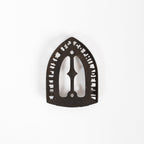 Dessous de plat en fer vintage triste