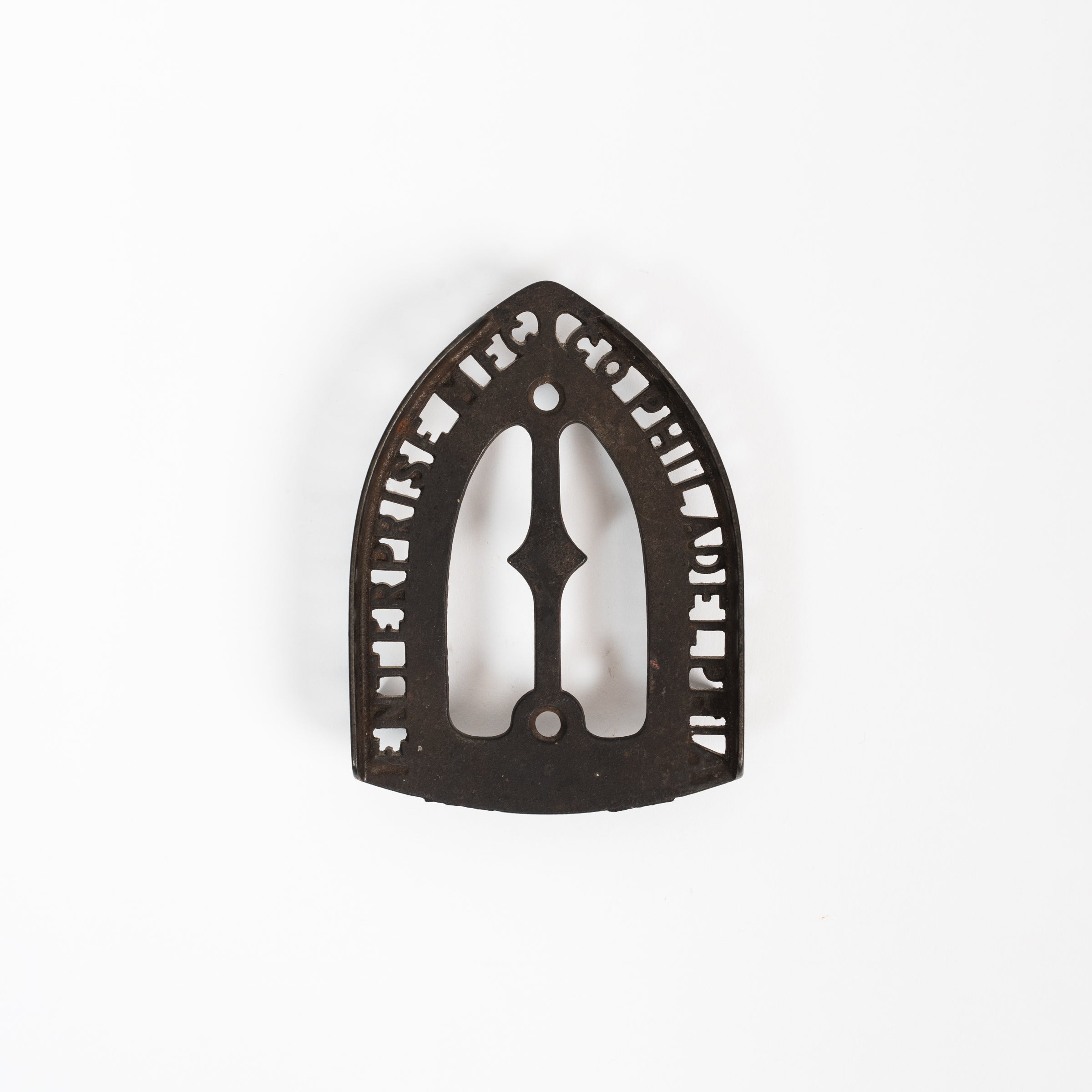 Dessous de plat en fer vintage triste