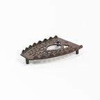 Dessous de plat en fer vintage triste