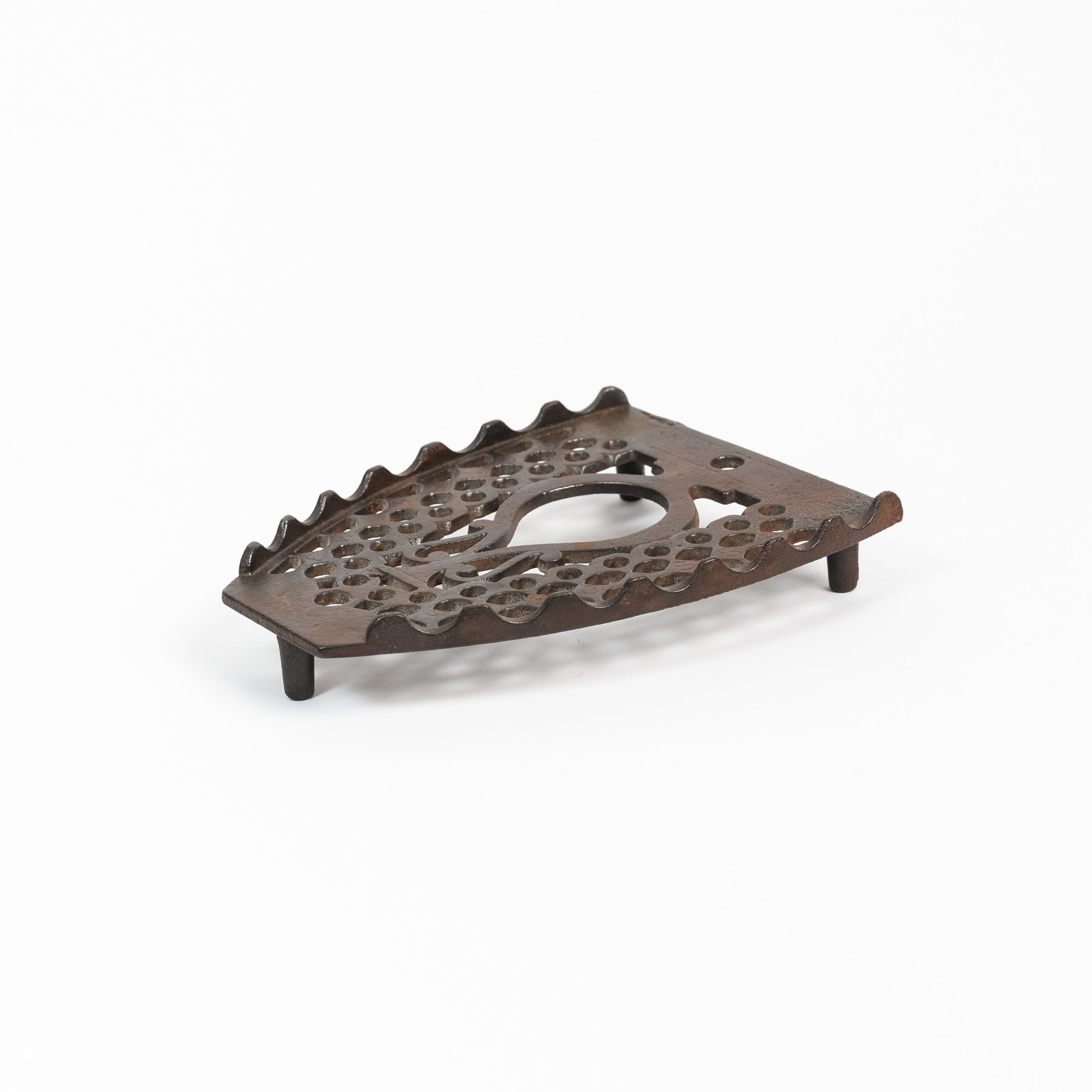 Dessous de plat en fer vintage triste