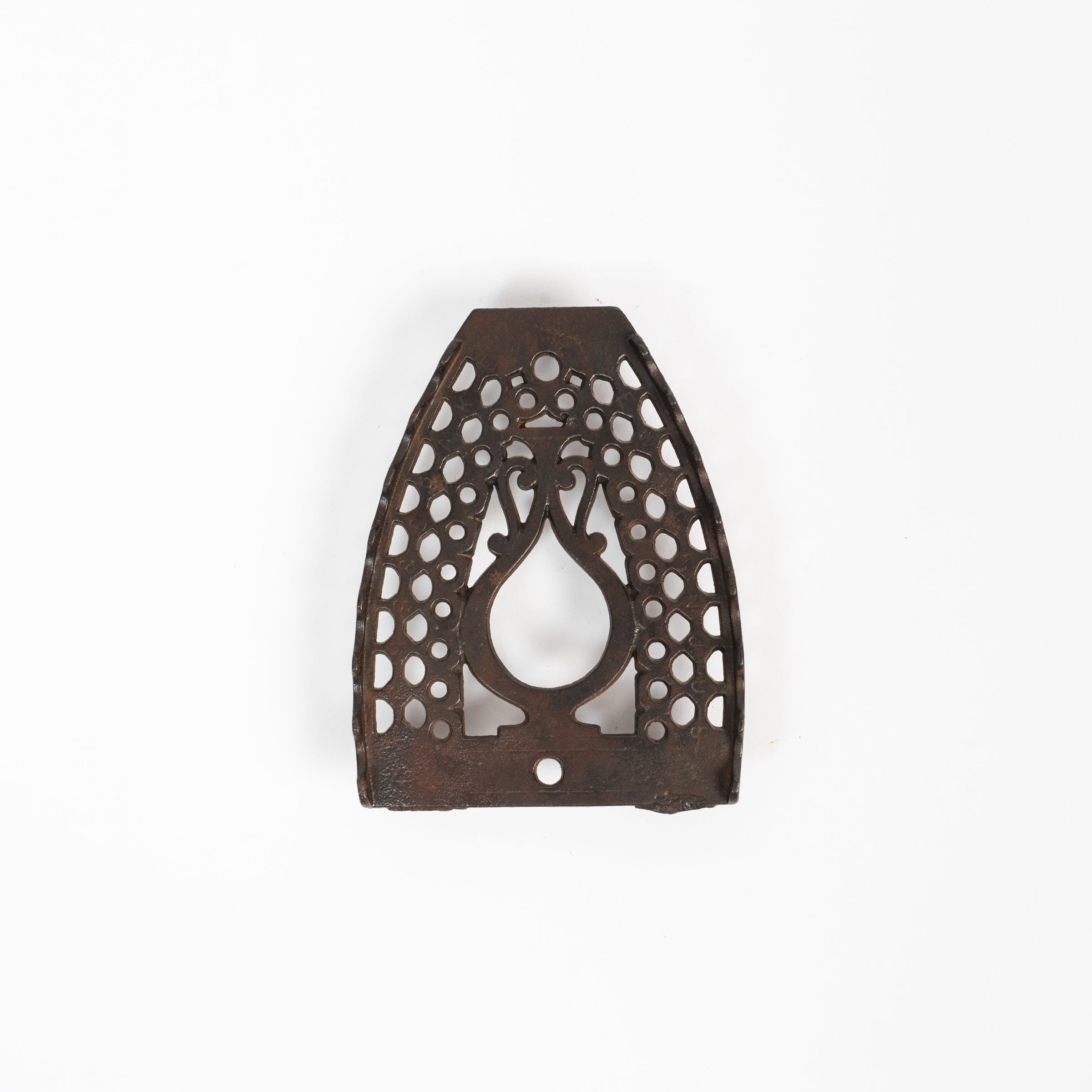 Dessous de plat en fer vintage triste