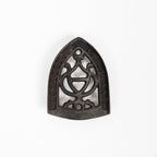 Dessous de plat en fer vintage triste