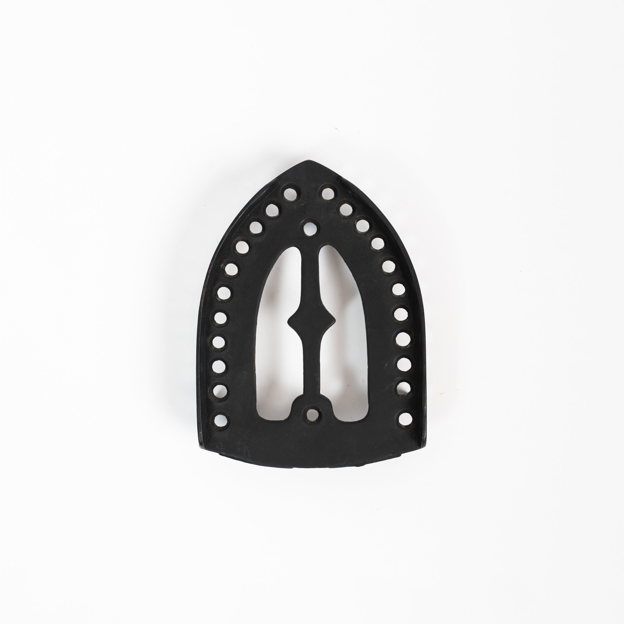 Dessous de plat en fer vintage triste