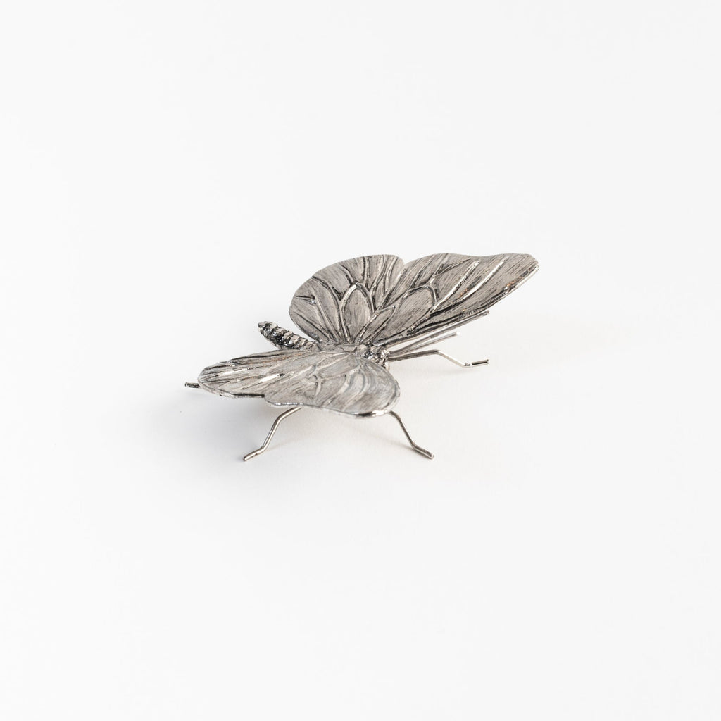 Papillon en étain antique