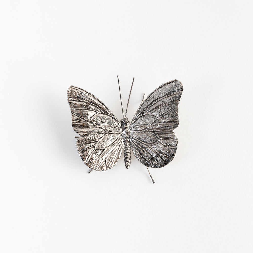 Papillon en étain antique
