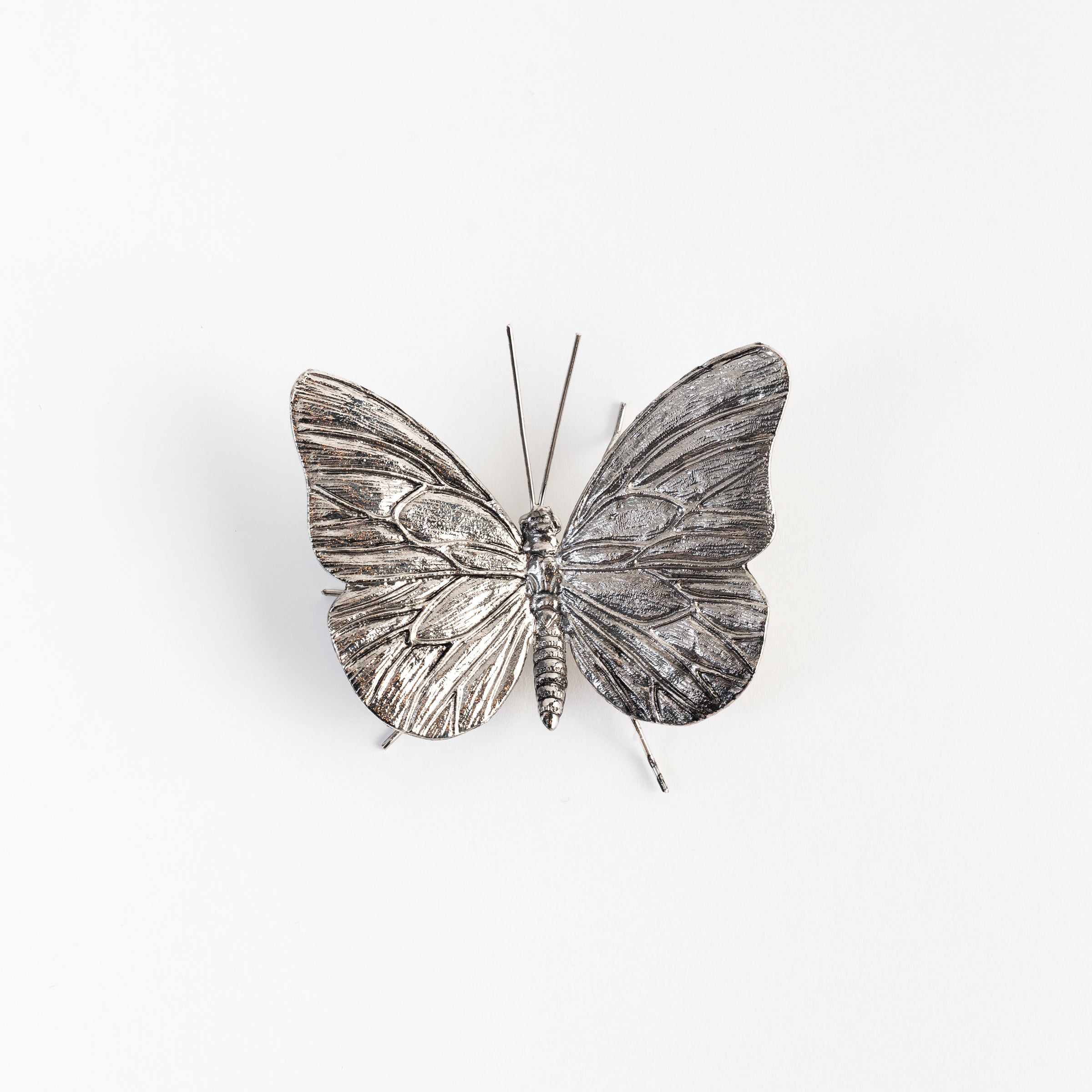 Papillon en étain antique