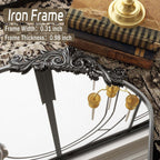 Miroir sur pied arqué à motif floral baroque