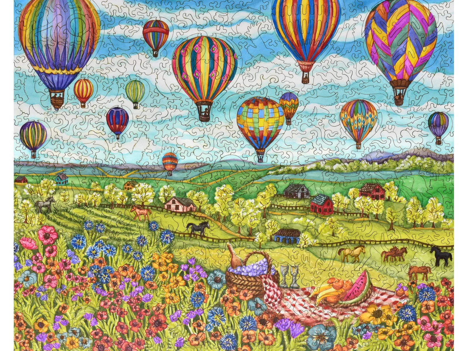 Ballons puzzle de la Liberté au-dessus des terres agricoles