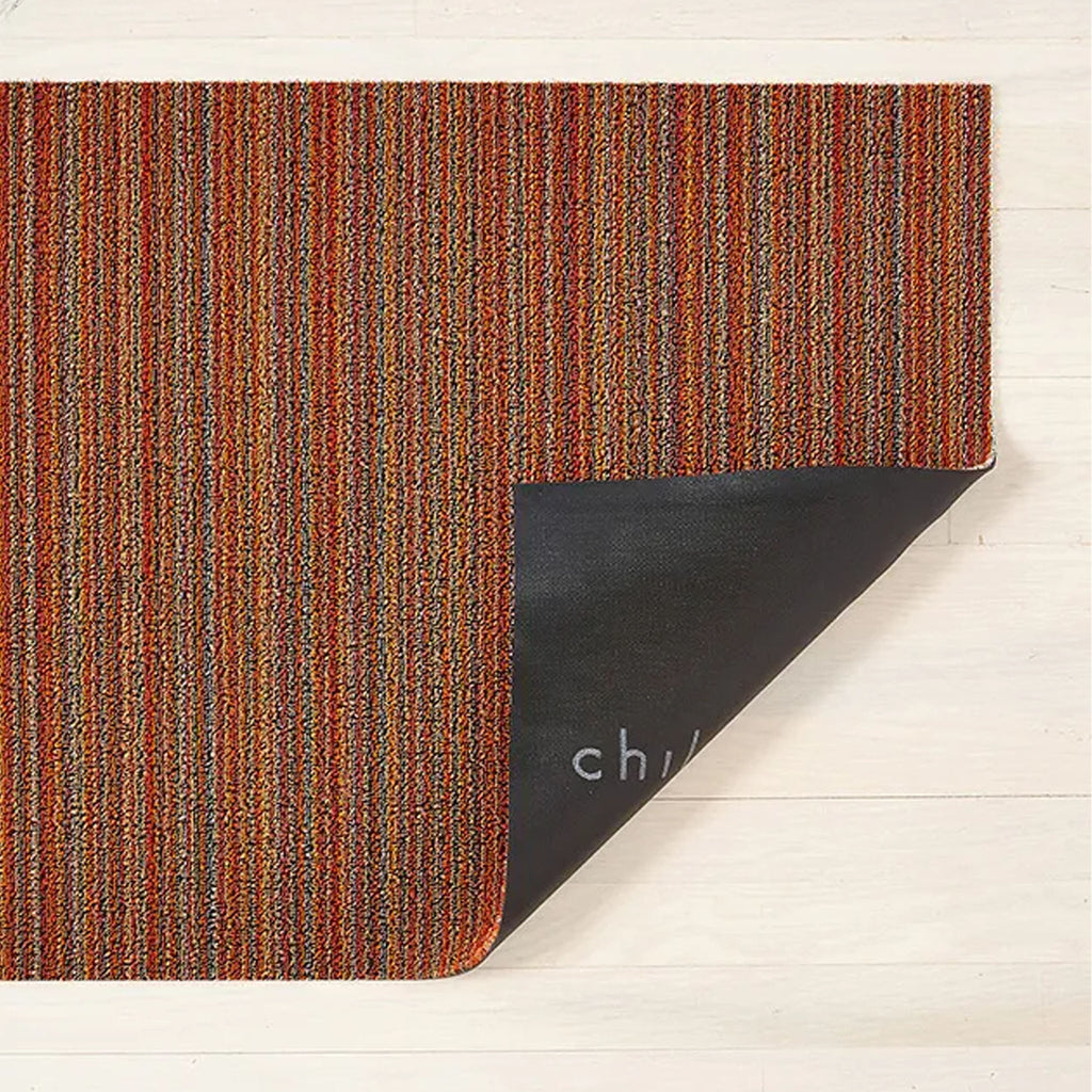 Tapis à poils longs à fines rayures orange Chilewich 