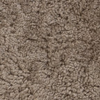 Pouf ovale Four Hands Bilbury en peau de mouton retournée taupe