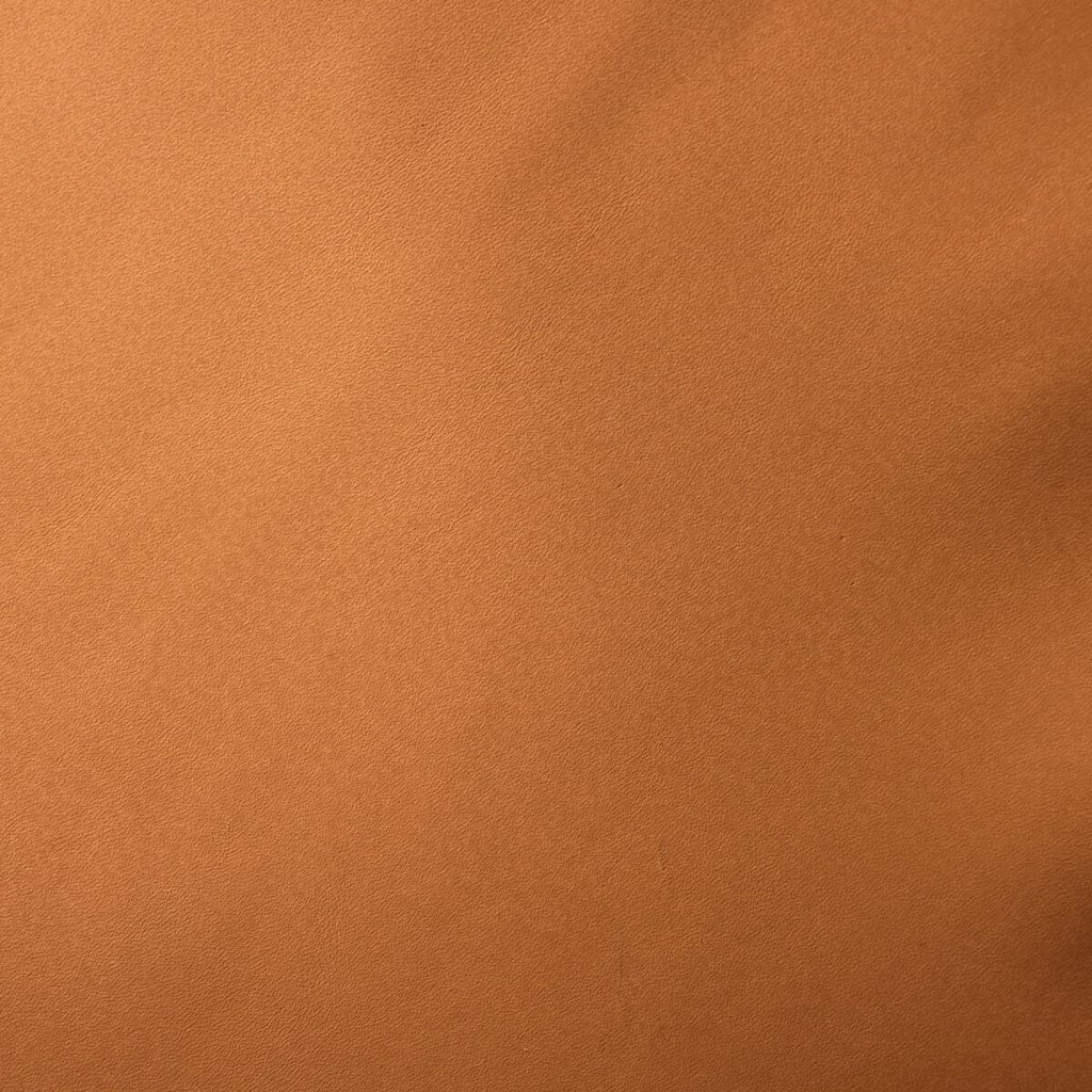 Tabouret de bar pivotant Lewis de Four Hands avec coussin en forme de selle de whisky