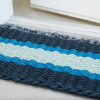 Tapis d'extérieur en corde de homard, coloris marine, bleu clair et vert d'eau