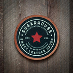 Utilise un putain de sous-verre en cuir