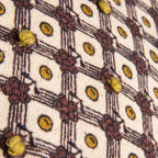 Petit coussin lombaire à pompons et nœuds français